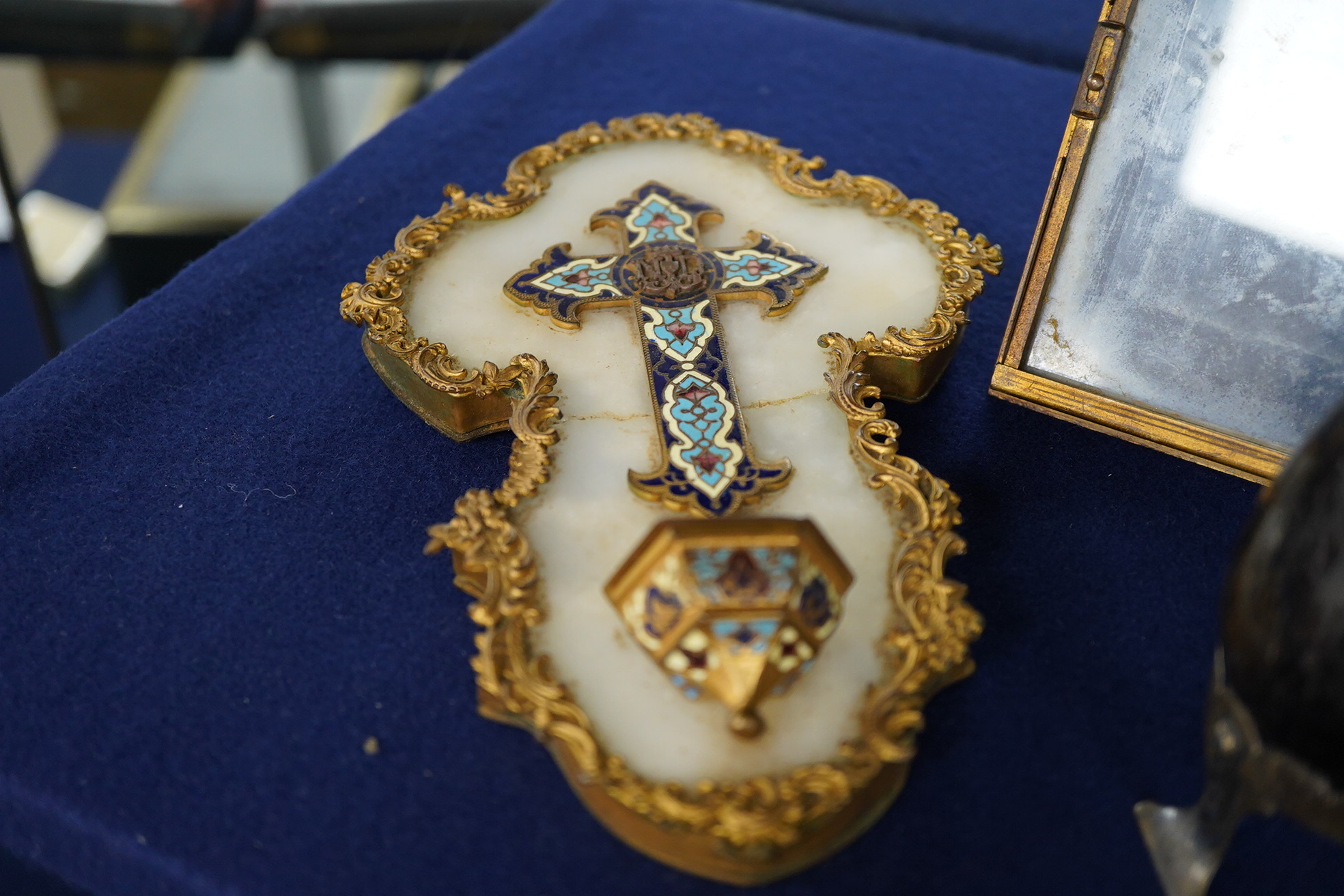 A Blue John egg, on white metal stand, an ormolu and alabaster candlestick cast as frogs, 18cm high, a French champleve, ormolu and alabaster holy water stoup and a gilt brass easel-back photograph frame